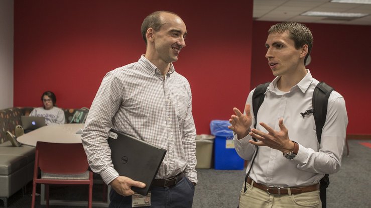 Librarian John Cyrus with med student Pauli Mui 